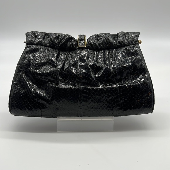 Black skin clutch with gold colored closure - Picture 1 of 4